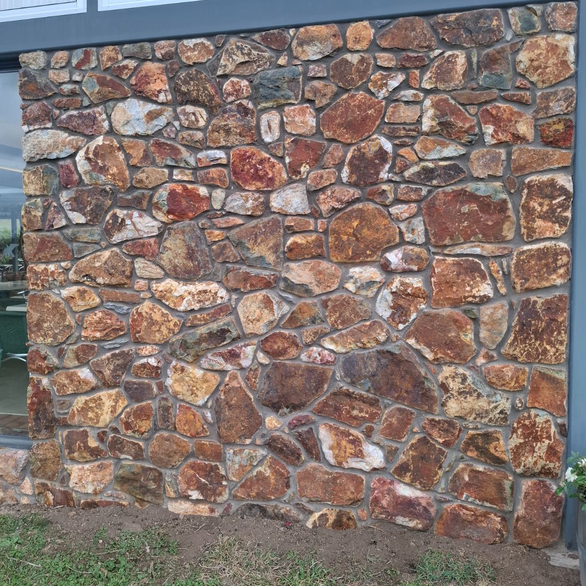 Field stone, mortared joint wall, natural stone masonry by Homestead Stonework, Canberra region