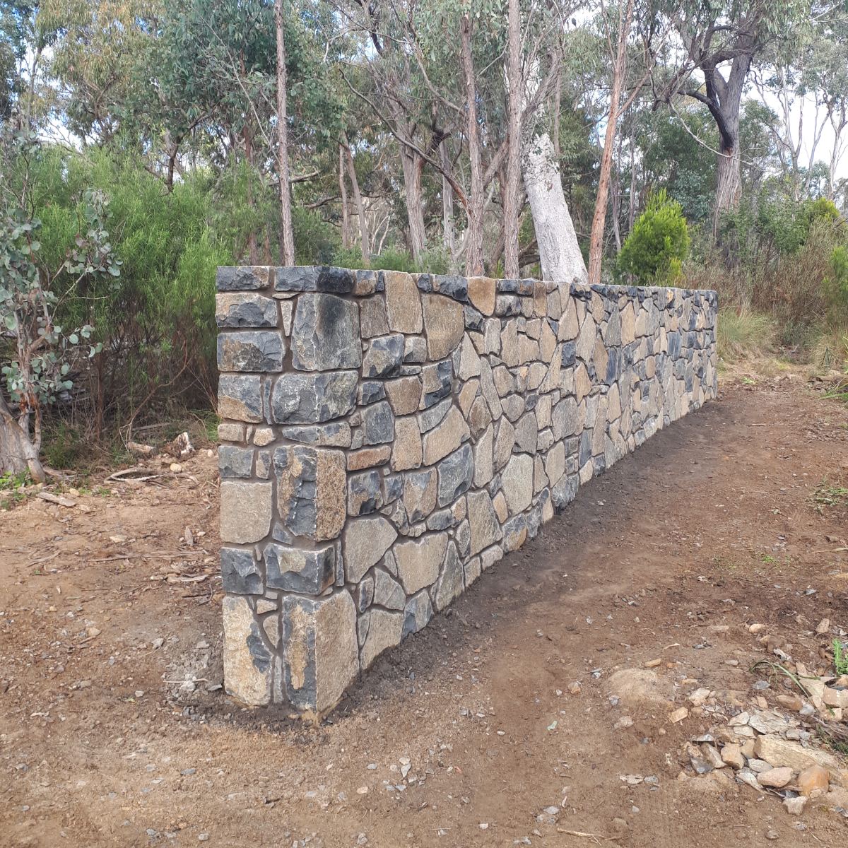 Nimmitabel basalt, raked mortar joint wall, natural stone masonry by Homestead Stonework, Canberra region