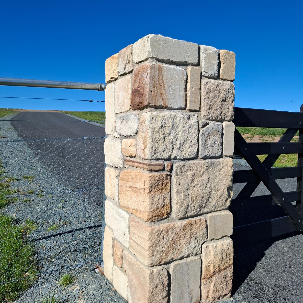 Sandstone feature panel with raked mortar joints, built by Homestead Stonework Canberra