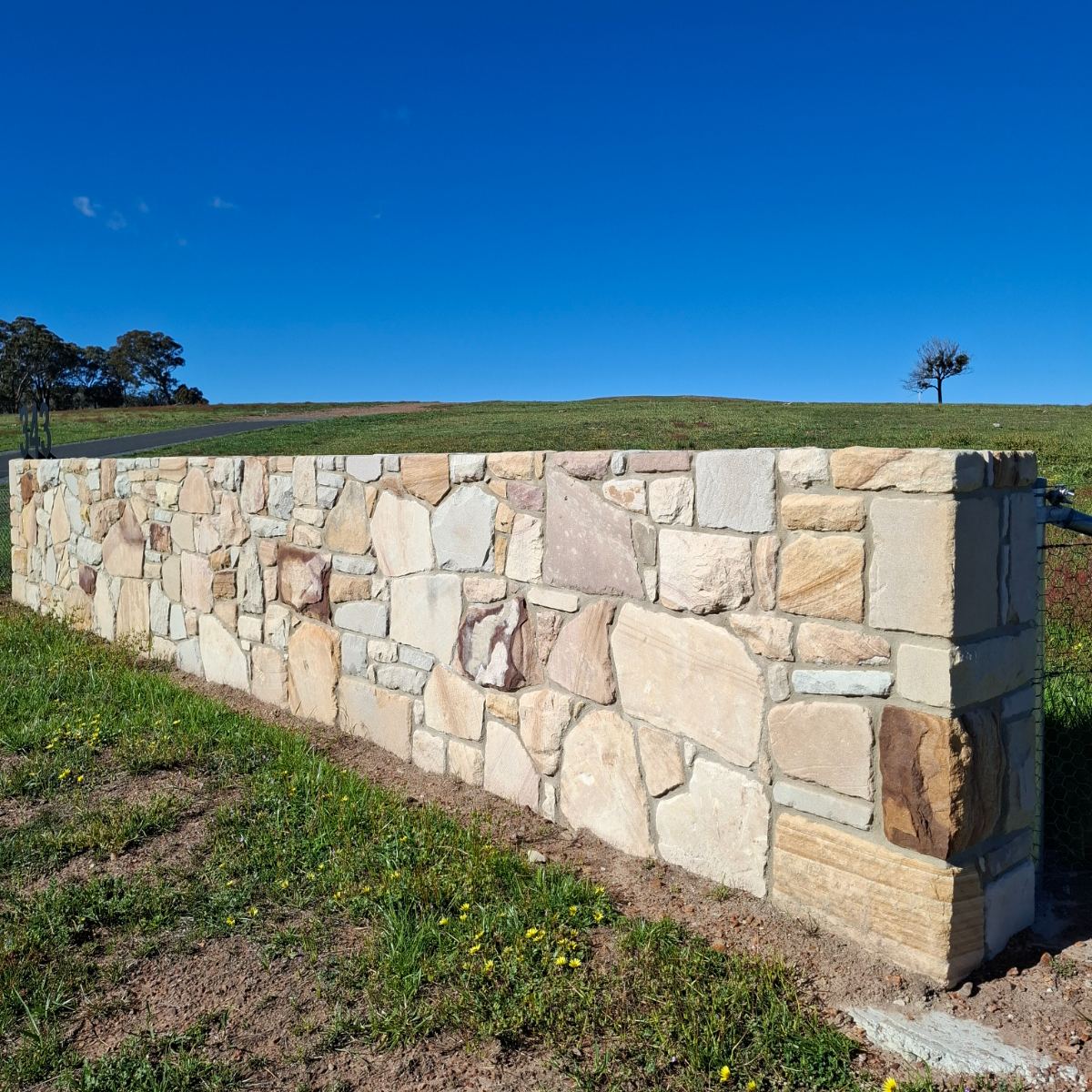 Sandstone, raked mortar joint wall, natural stone masonry by Homestead Stonework, Canberra region