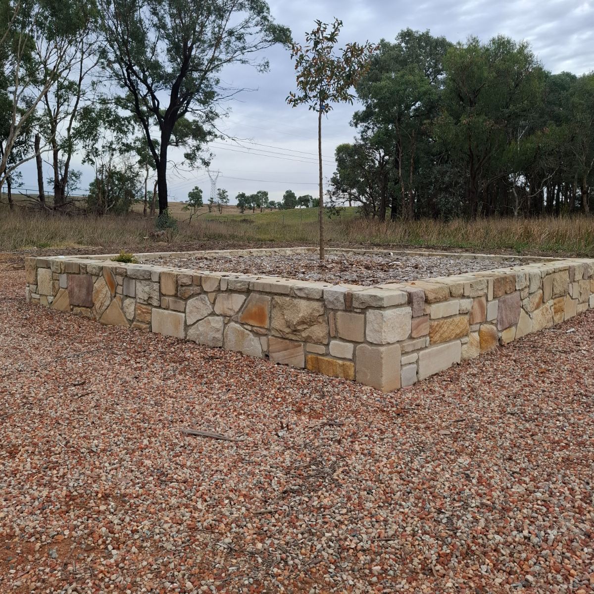 Sandstone wall with raked mortar joints, Canberra region