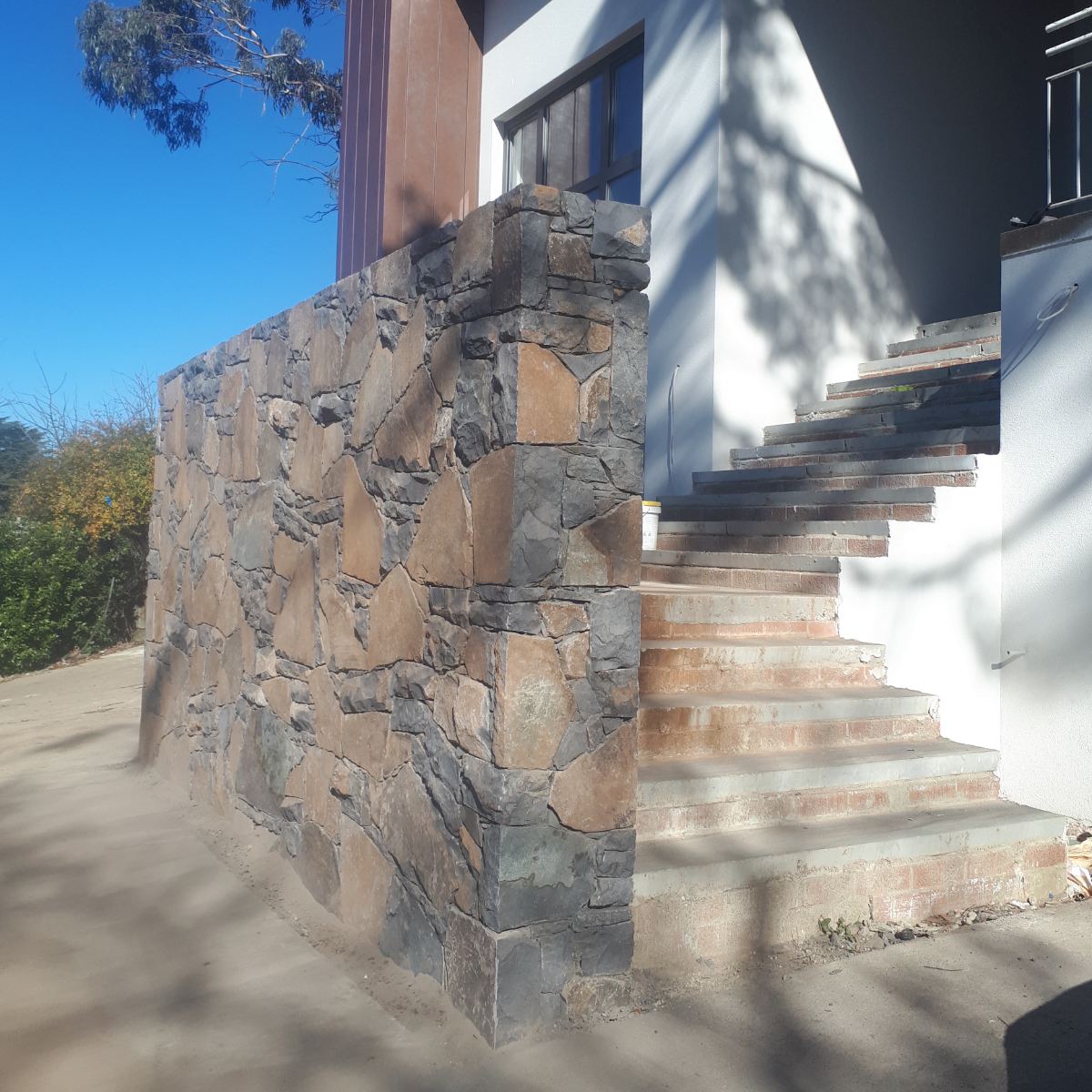 Hand-fitted Wee Jasper basalt stonework by stone mason David Korda