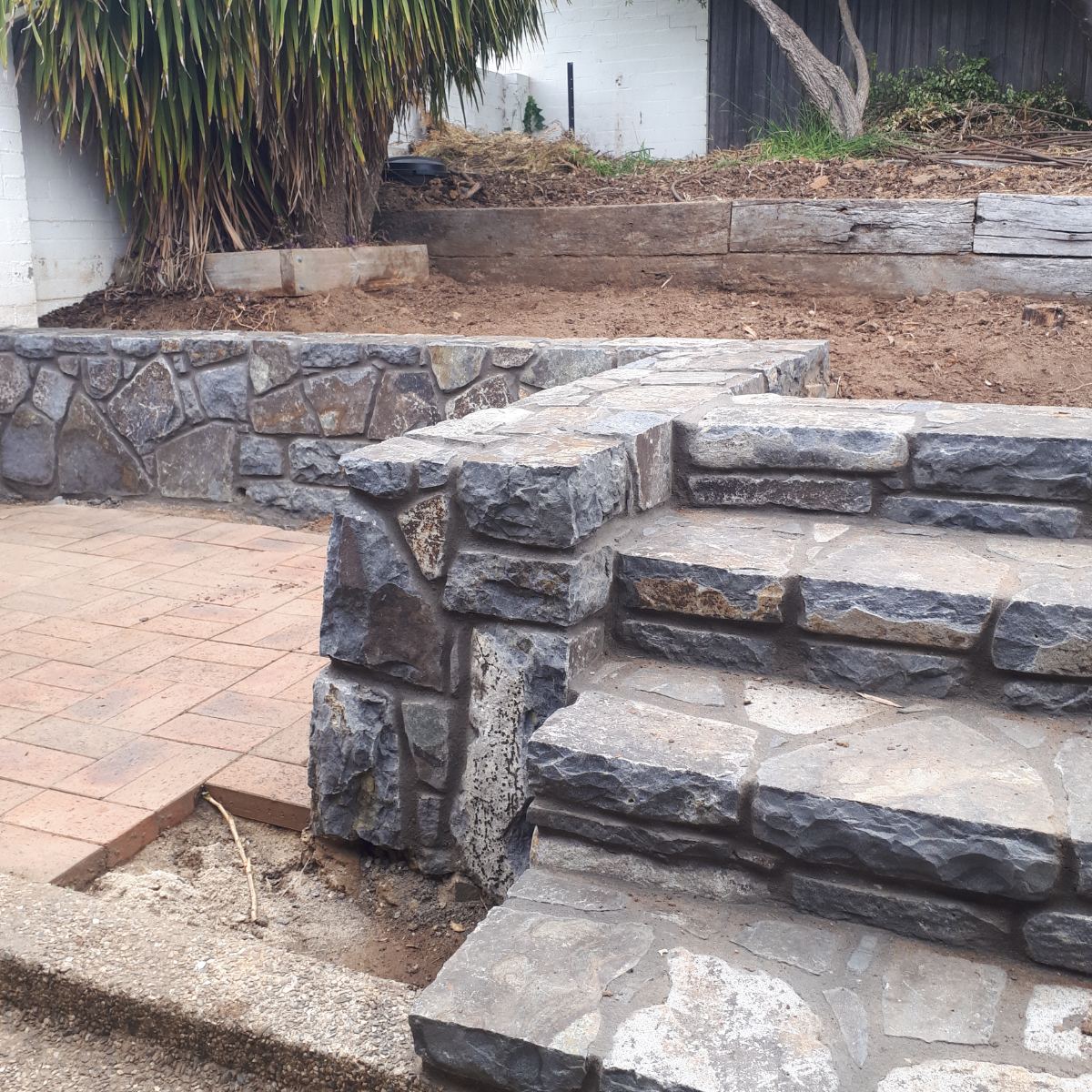 Wee Jasper basalt, raked mortar joint wall, natural stone masonry by Homestead Stonework, Canberra region